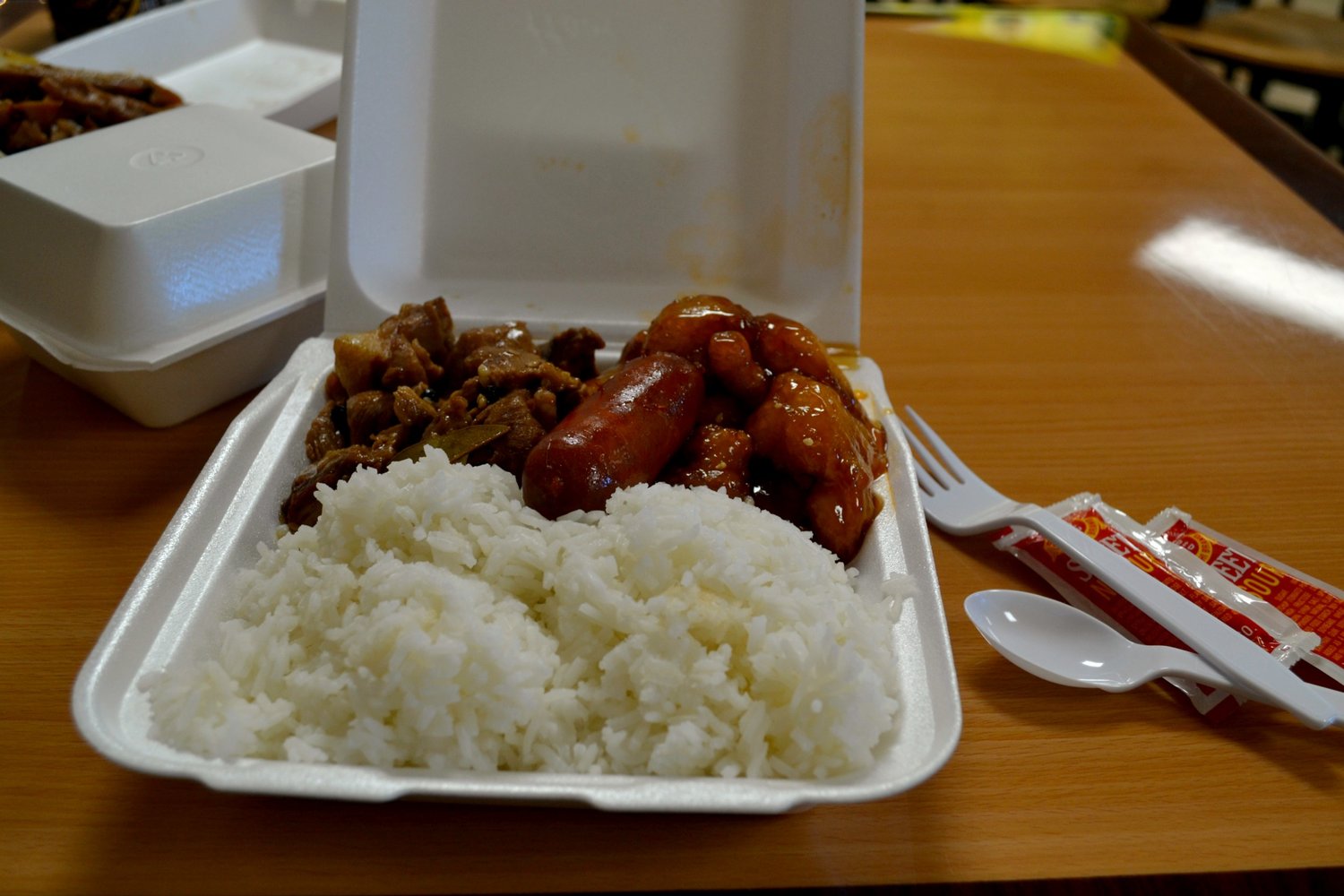 The two entree combo included steamed rice, longanisa sausage, pork adobo and sesame chicken. 